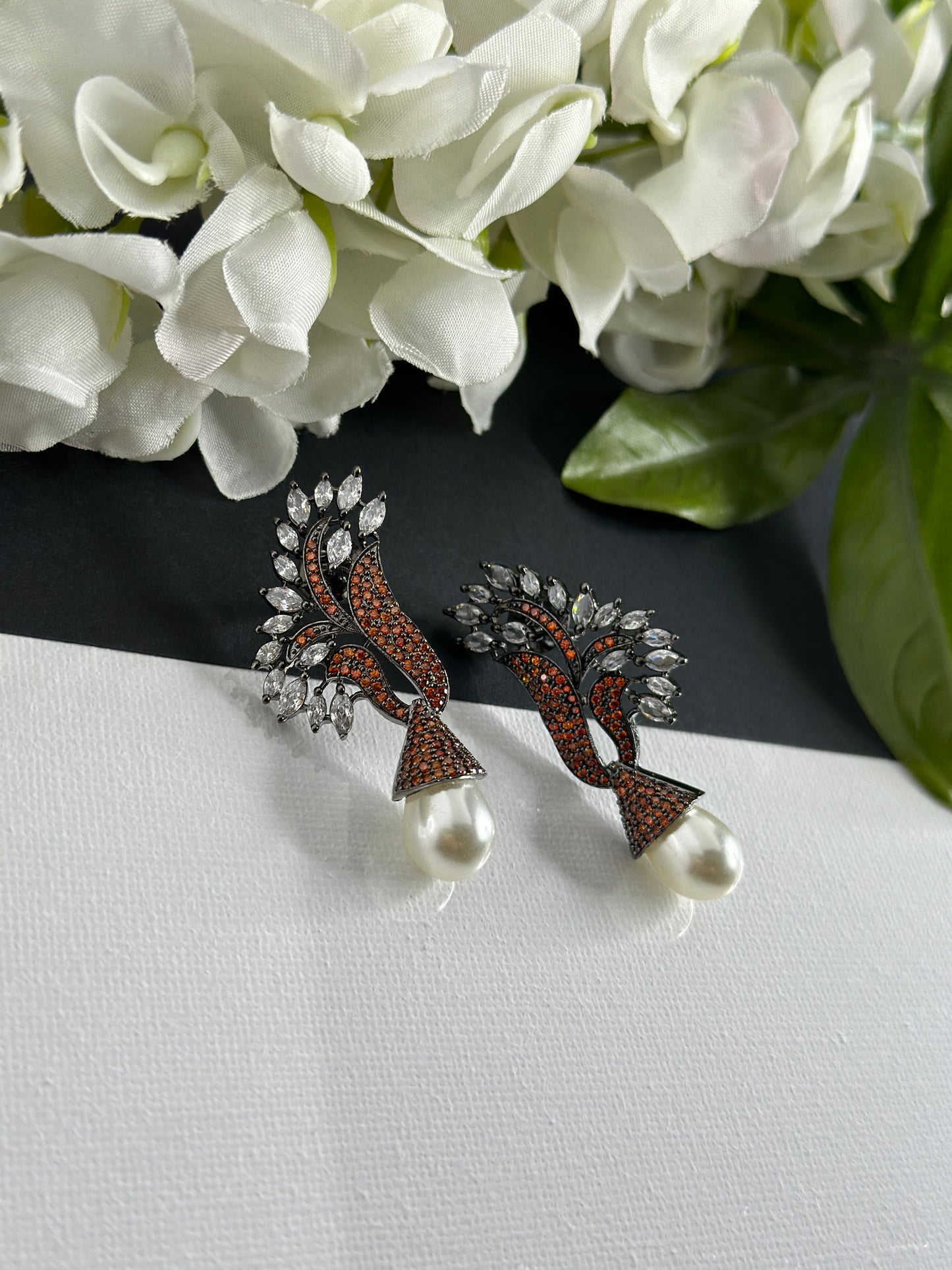 Rust earrings in American diamonds