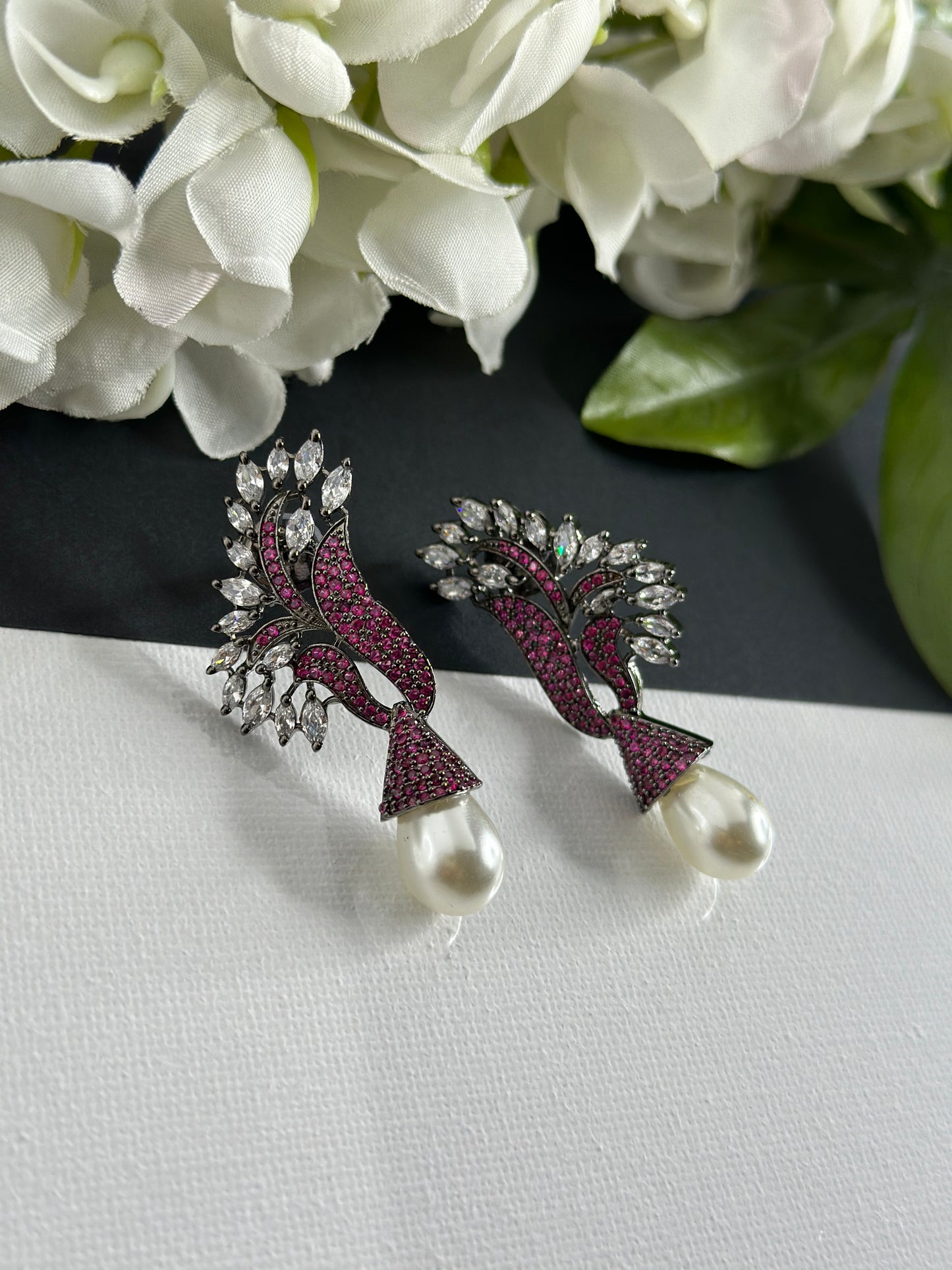 Pink earrings in American diamonds