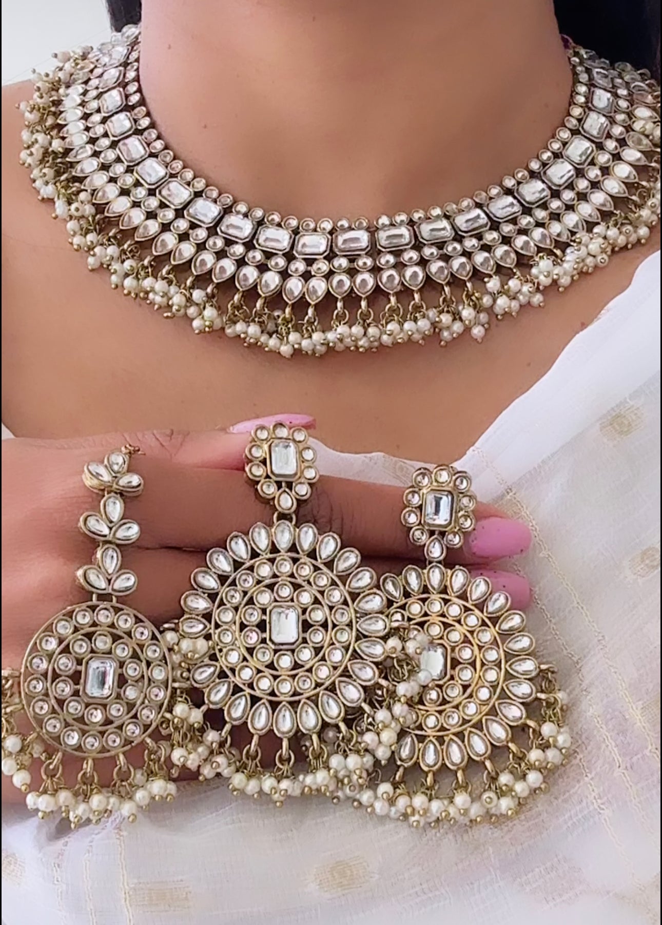 Kundan necklace set in golden white