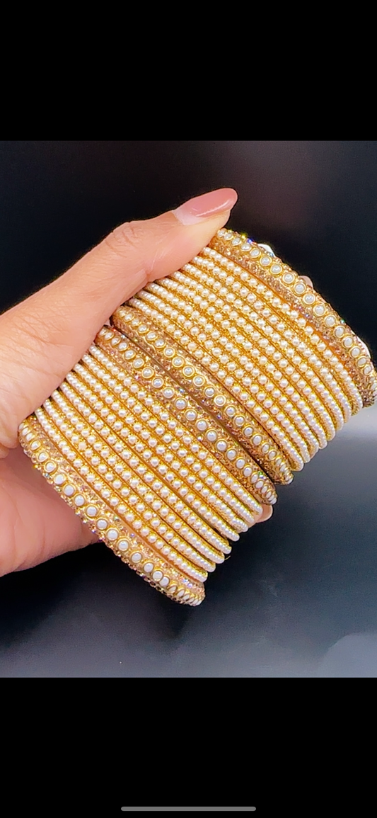 Golden white bangles set