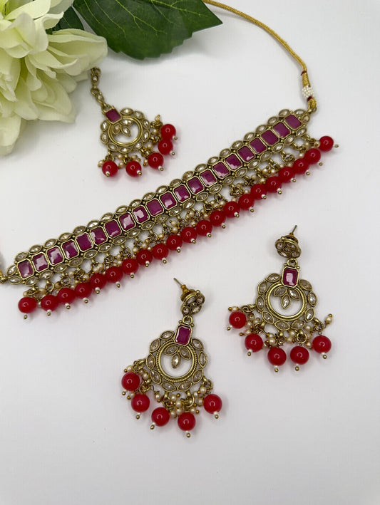 Polki set in magenta and red colour