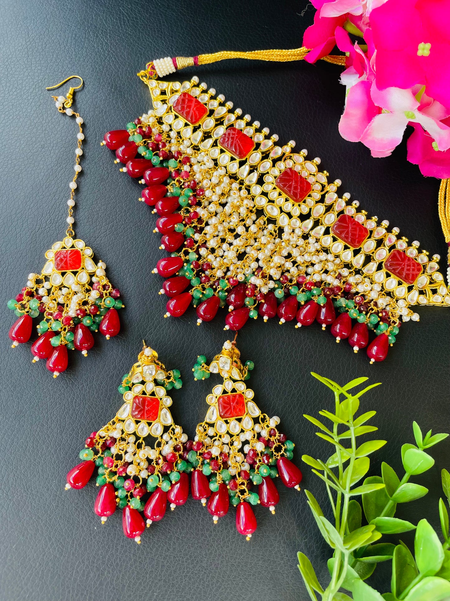 Statement neck piece with earrings and tikka in mehroon colour