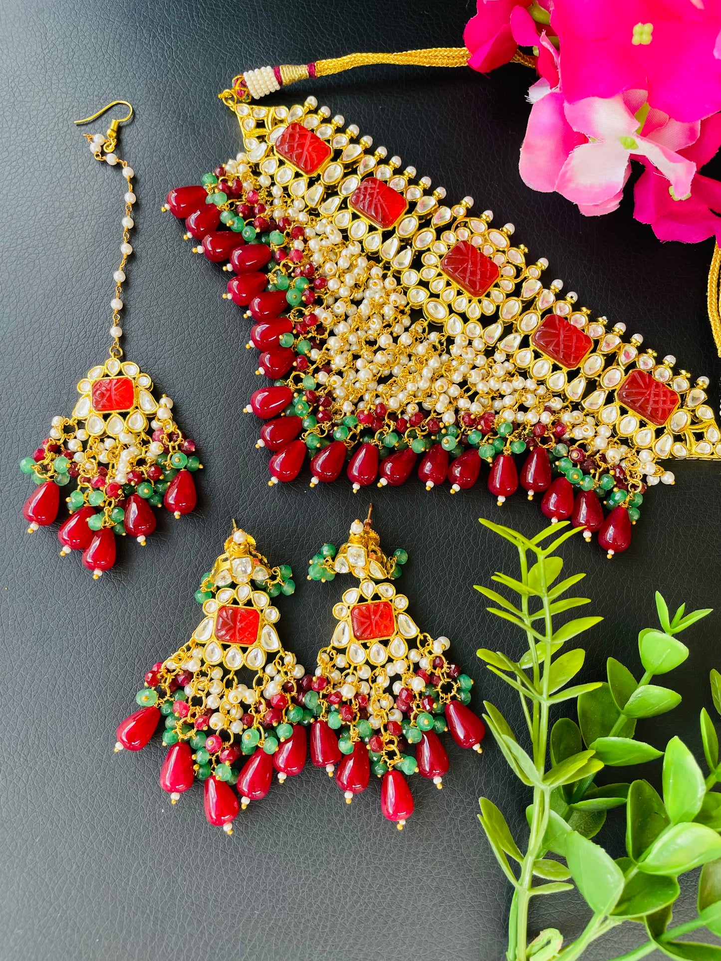 Statement neck piece with earrings and tikka in mehroon colour