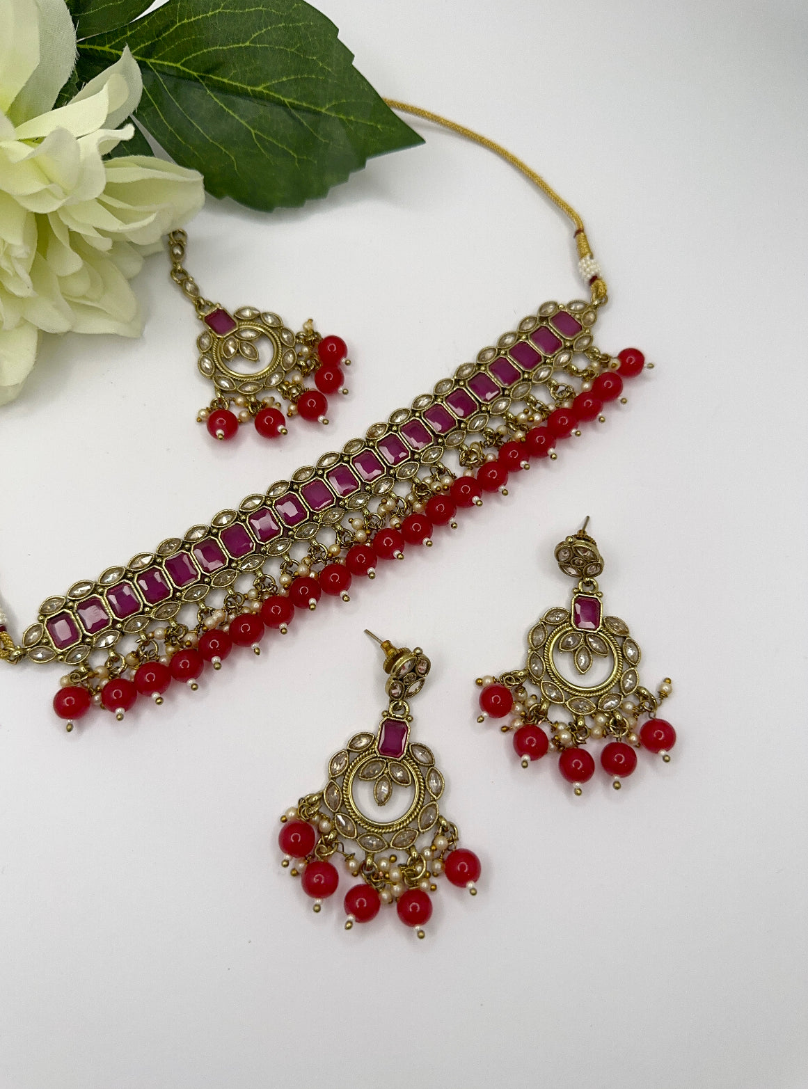 Polki set in magenta and red colour